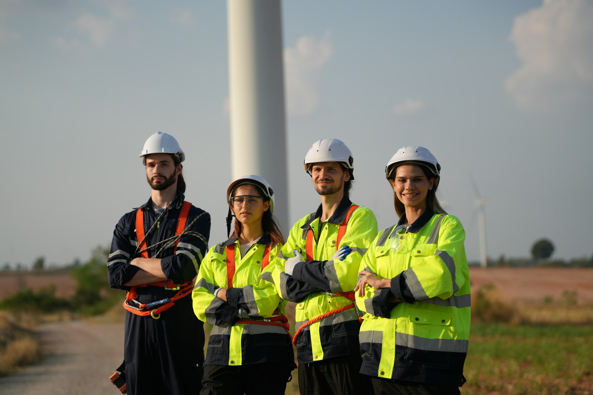 Sustainable energy industry - Engineers working at alternative renewable wind energy farm